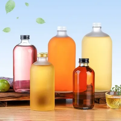 أشكال العلب الزجاجية المتوفرة للعصير والمشروبات